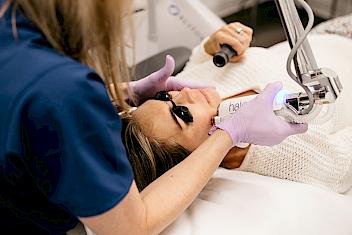 Woman receiving laser therapy